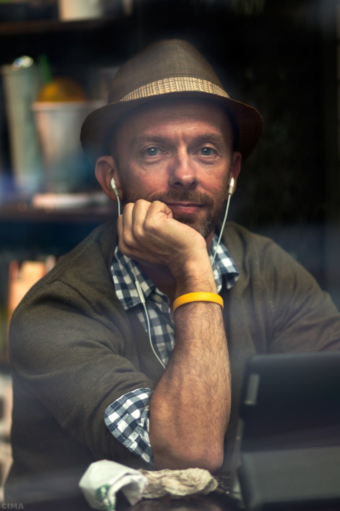 Photographer In Coffee Shop Window